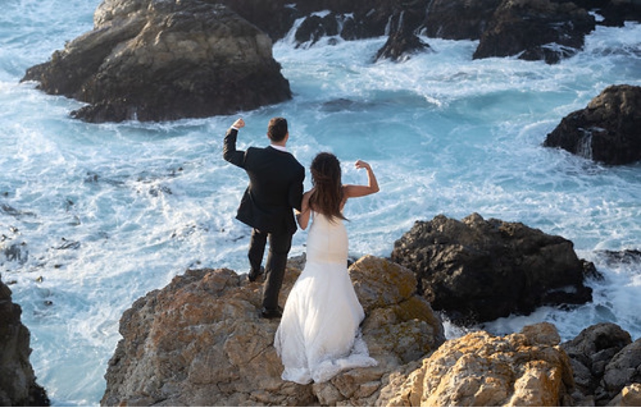 Ruben and Janeza flexing on the coast on their wedding day